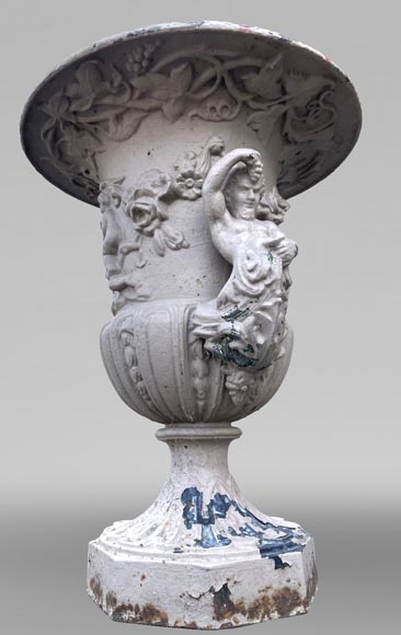 Cast iron garden vase with a frieze of cupids and handles formed as winged putti Cast iron garden vase with a frieze of cupids and handles formed as winged putti-3