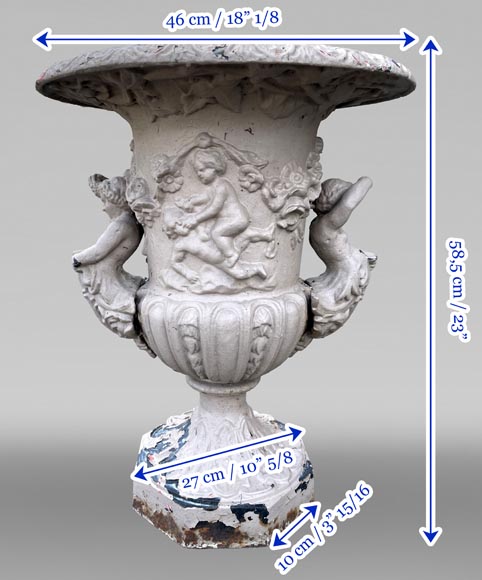 Cast iron garden vase with a frieze of cupids and handles formed as winged putti Cast iron garden vase with a frieze of cupids and handles formed as winged putti-7