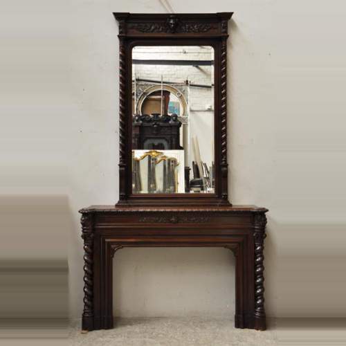 Large oak wood Louis XIII style fireplace with trumeau mirror