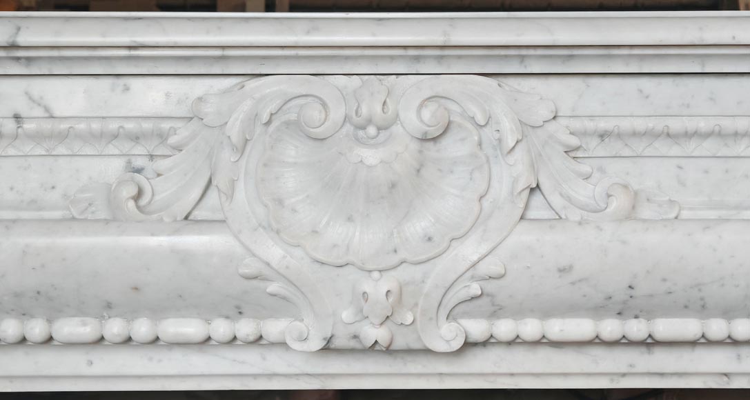 Louis XIV-style fireplace in Carrara marble, featuring a beaded molding-1
