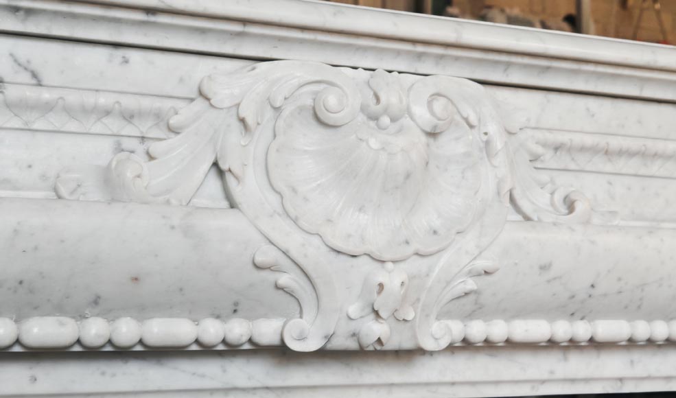 Louis XIV-style fireplace in Carrara marble, featuring a beaded molding-2