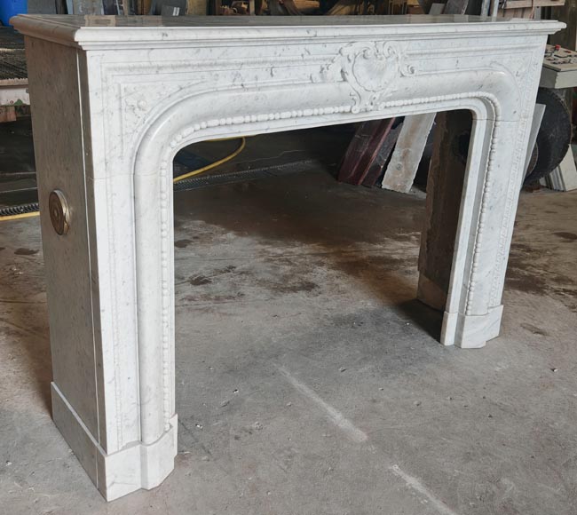 Louis XIV-style fireplace in Carrara marble, featuring a beaded molding-4