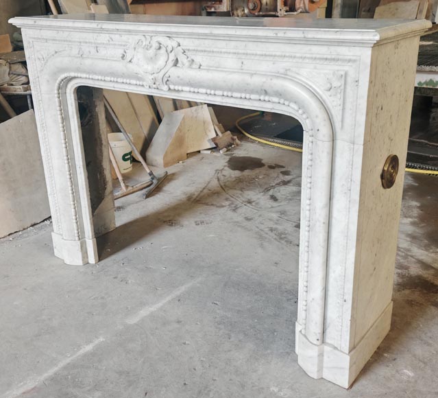 Louis XIV-style fireplace in Carrara marble, featuring a beaded molding-8