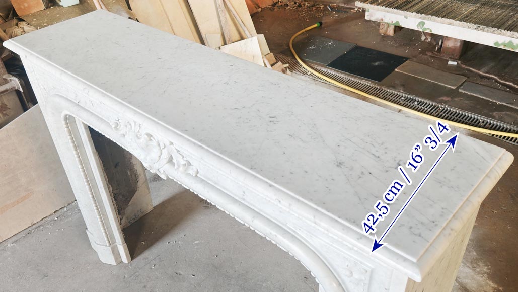 Louis XIV-style fireplace in Carrara marble, featuring a beaded molding-11