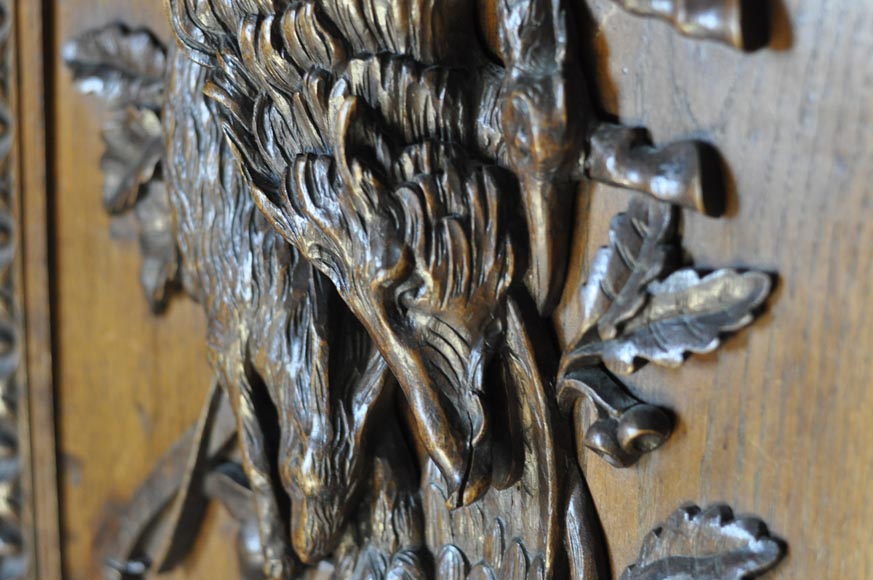 Large antique carved oak wood paneled room with hunting trophies and still lifes decor-12