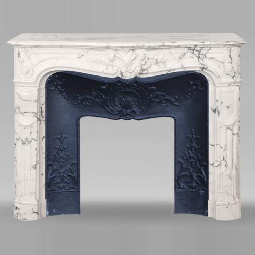 Louis XV style fireplace in Paonazzo marble decorated with a foliate shell