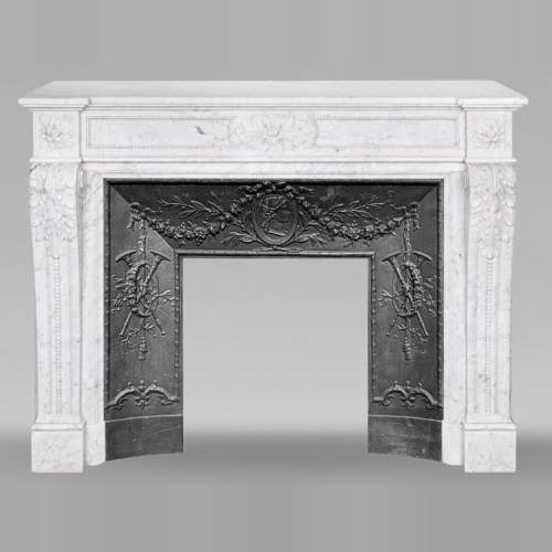Louis XVI style fireplace in Carrara marble, decorated with acanthus leaves