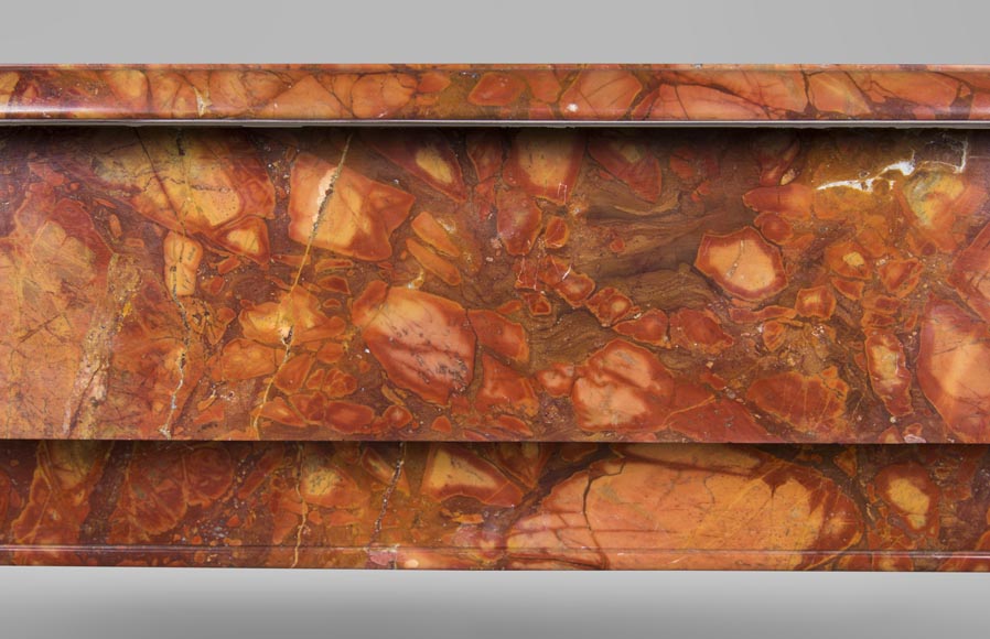 An antique Napoléon III style fireplace, made out of Breche Sanguine marble, with 