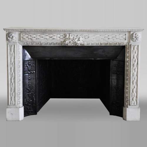 Antique Louis XVI period fireplace in Carrara marble decorated with grapevines and grapes