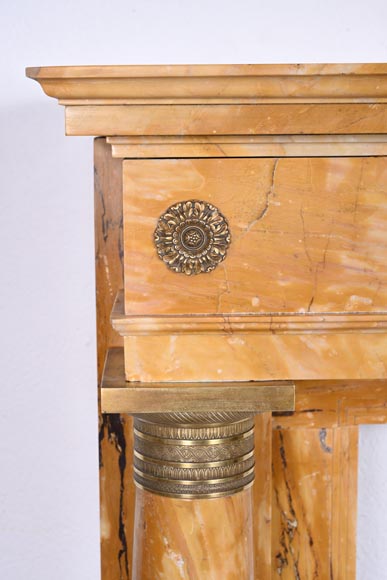 Empire style fireplace in Sienna yellow marble with columns and gilt bronze rosettes-4