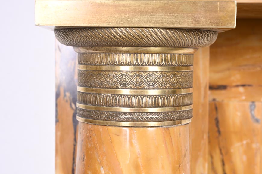 Empire style fireplace in Sienna yellow marble with columns and gilt bronze rosettes-5