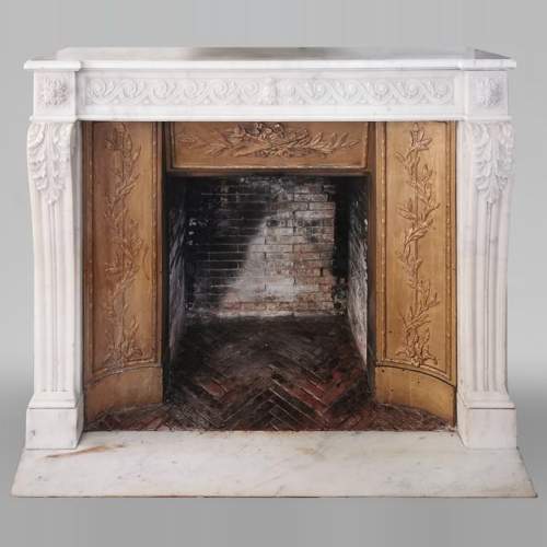 Louis XVI fireplace of white marble with a Greek frieze