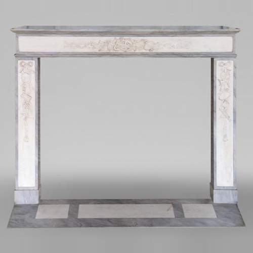 Louis XVI style mantel in statuary and Blue Turquin marbles with music instruments