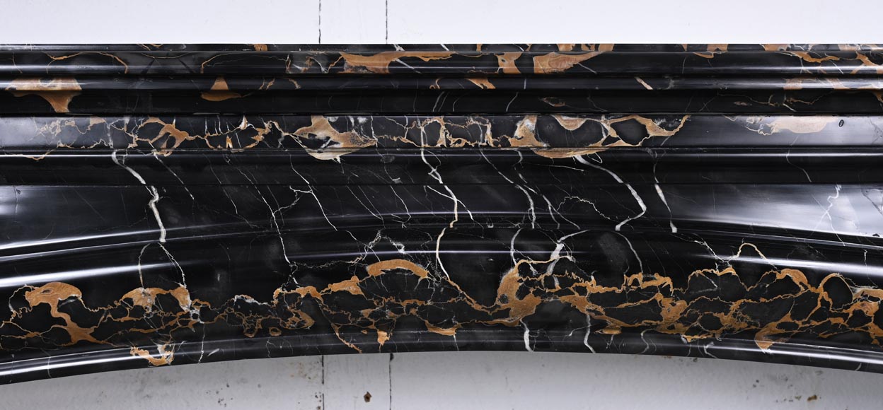 Louis XIV style fireplace in Portoro marble, with a molding and rounded frieze Louis XIV style fireplace in Portoro marble, with a molding and rounded frieze-1