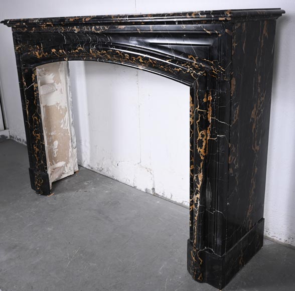 Louis XIV style fireplace in Portoro marble, with a molding and rounded frieze Louis XIV style fireplace in Portoro marble, with a molding and rounded frieze-5