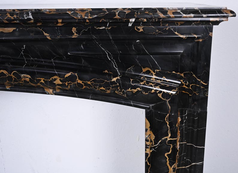 Louis XIV style fireplace in Portoro marble, with a molding and rounded frieze Louis XIV style fireplace in Portoro marble, with a molding and rounded frieze-6