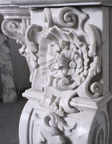 A richly sculpted Carrara marble fireplace in the Napoleon III style, decorated with a lion's head.-10