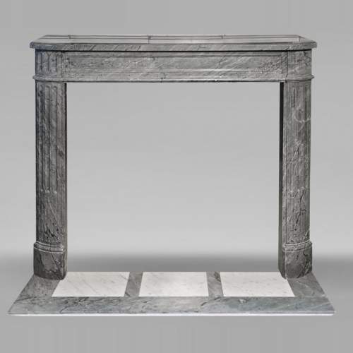 Louis XVI style Bleu Turquin marble fireplace with fluted legs