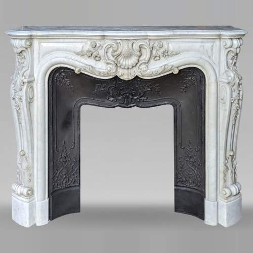 Louis XV style Carrara marble mantel with carved floral décor