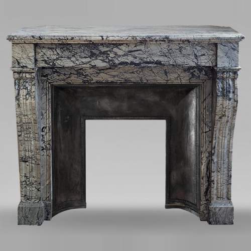 Cheminée Napoléon III à pieds en console en marbre Bleu Fleury