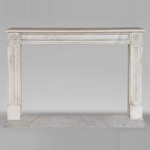 Louis XVI period mantel with pearls and carved ribbon