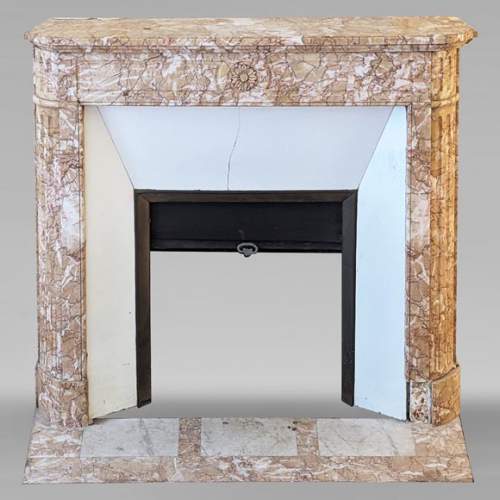 Louis XVI style mantel in Brocatelle marble with rounded corners adorned with a sunflower