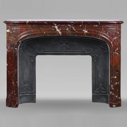 Regence style mantel carved in Griotte red marble