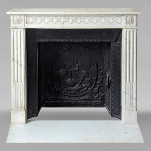 Louis XVI style mantel in semi-statuary marble adorned with a Greek frieze