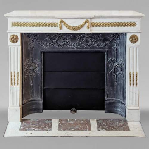 Louis XVI style mantel with garland and frieze of flowers