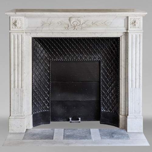 Louis XVI style Carrara marble mantel decorated with a laurel wreath