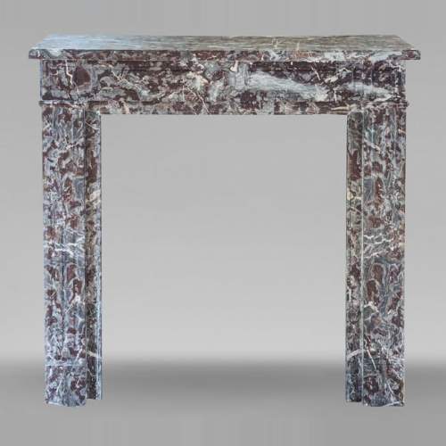 Louis XVI style mantel in Rouge Royal marble