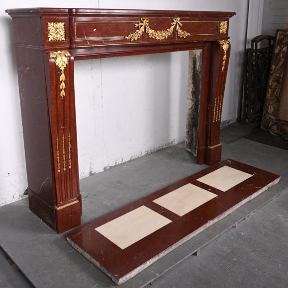 Louis XVI style fireplace in Antique Red marble, with bronze mounts, decorated with a garland-4