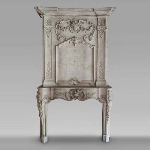 Louis XV period stone mantel with carved overmantel
