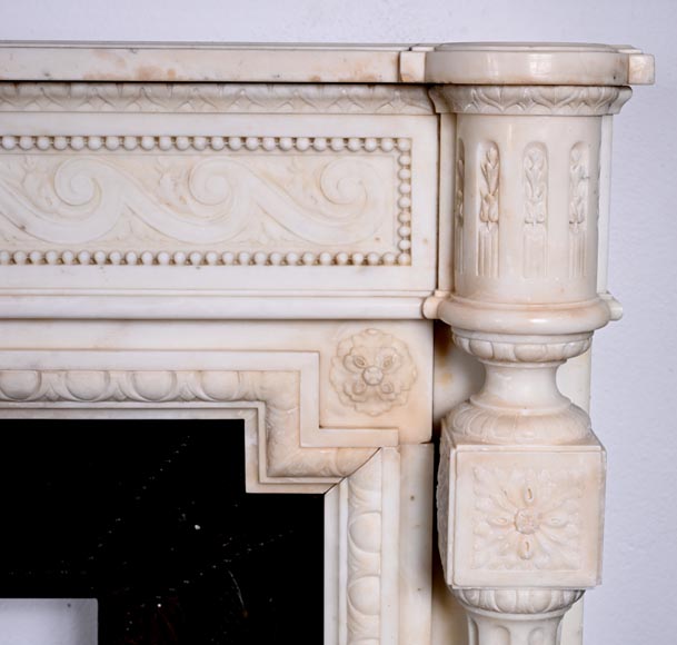 Louis XVI style white marble fireplace with columns and female profile medallion-11