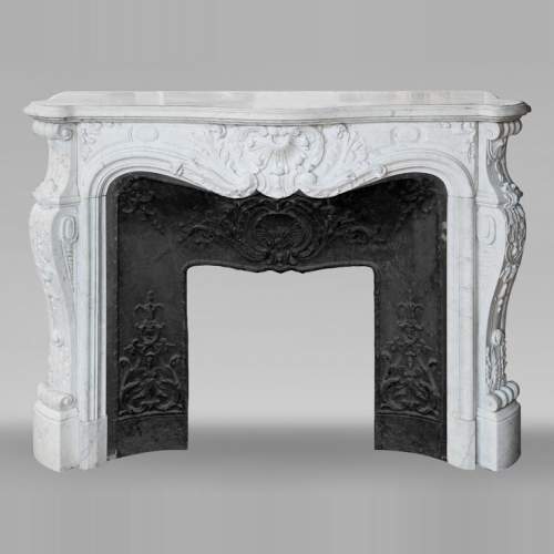 Louis XV style fireplace, highly sculpted in Carrara marble, from northern France