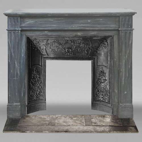 Louis XVI style fireplace in blue turquin marble, with single fluting