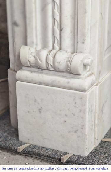 Louis XVI style fireplace in Carrara marble decorated with a bow and a quiver-11