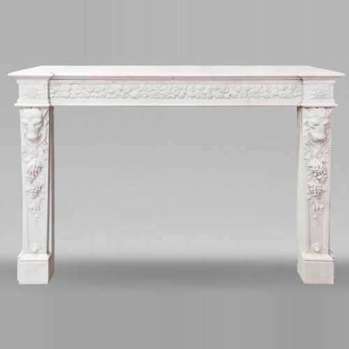 Napoleon III style fireplace in statuary marble, decorated with fruit and a goat's head