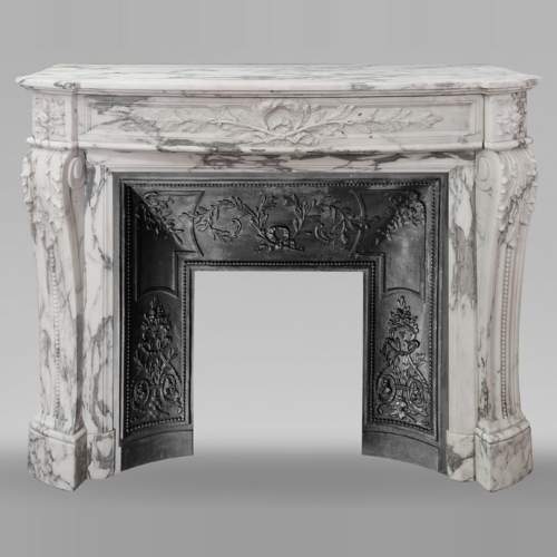Curved Louis XVI style fireplace in Arabescato marble, decorated with a laurel wreath