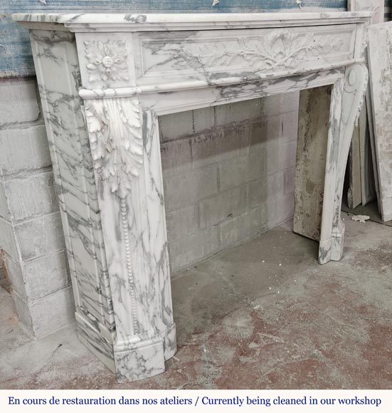 Curved Louis XVI style fireplace in Arabescato marble, decorated with a laurel wreath-5
