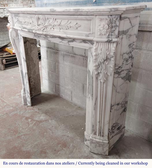 Curved Louis XVI style fireplace in Arabescato marble, decorated with a laurel wreath-9
