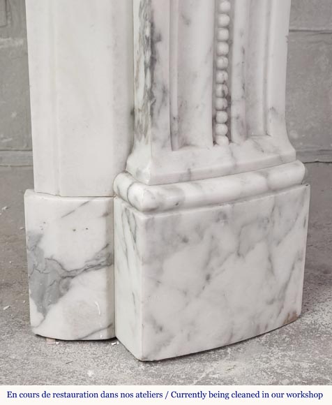 Curved Louis XVI style fireplace in Arabescato marble, decorated with a laurel wreath-11