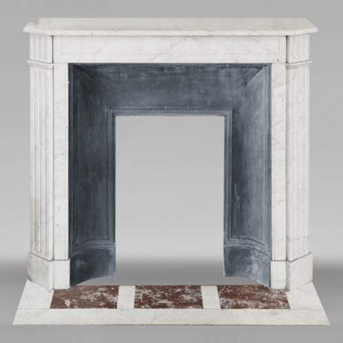 Louis XVI style fireplace in Carrara marble, with fluted legs