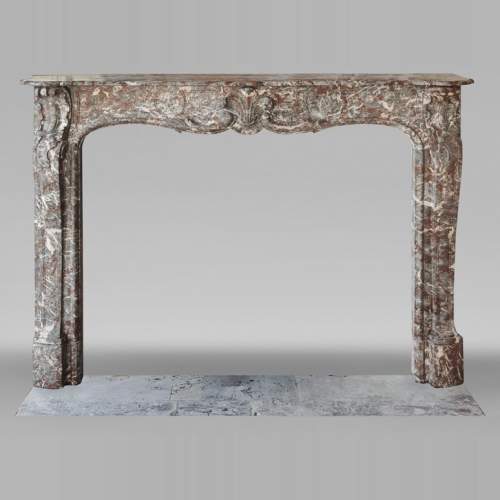 Louis XV period fireplace in Royal Red, decorated with a palmette
