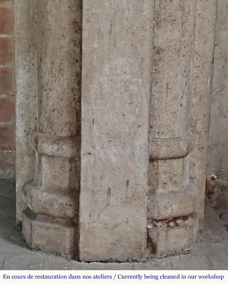 Carved stone fireplace with three-faced mask decoration-7