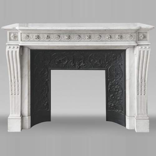 Louis XVI style fireplace in Carrara marble, decorated with pearls and macaroons