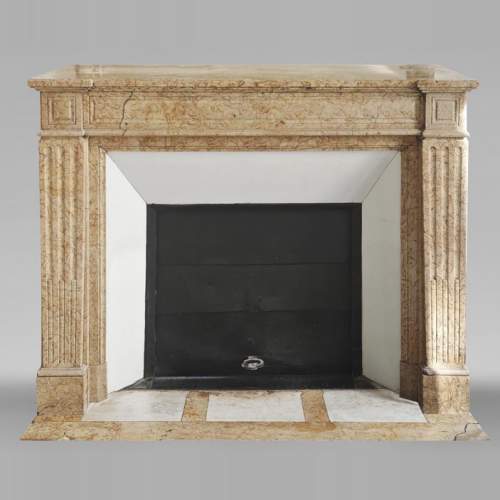 Louis XVI style fireplace with molded decoration, in yellow marble