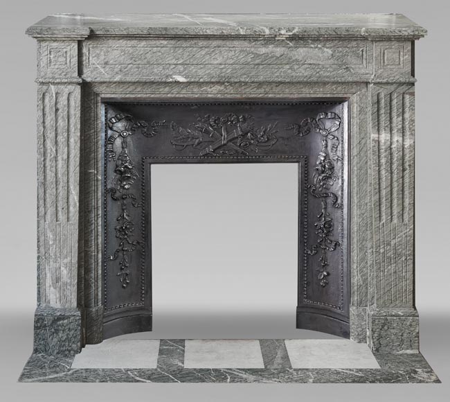 Louis XVI style fireplace with molded decoration, in green Campan marble-0