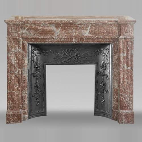 Louis XVI style fireplace with molded decoration, in red Campan marble