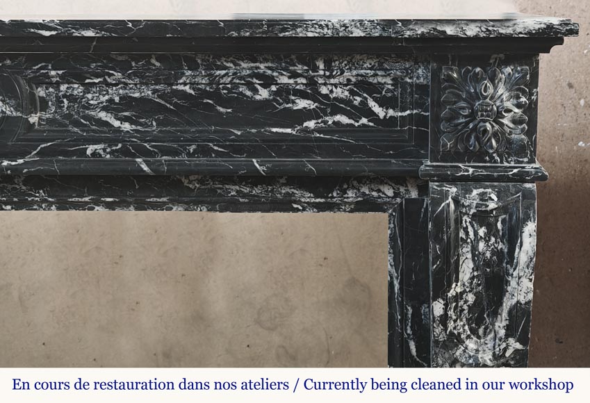 Louis XVI style fireplace decorated with a flower, in black Marquina marble-7
